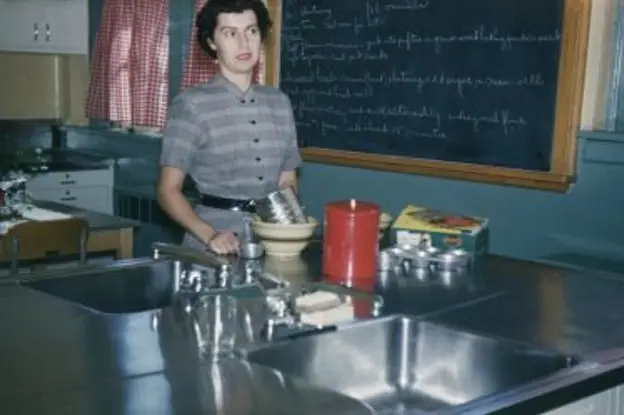 "P.S.619 Home Economics Lab, where patients learn short-order cooking and baking. North Brother Island, 1953."